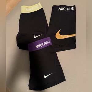 Nike Pro Women's Athletic Shorts - Black, Gold, Purple